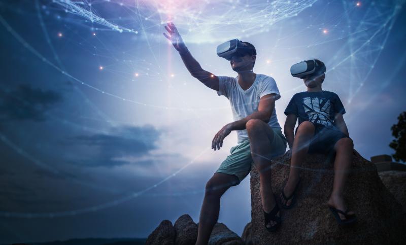Man and boy using VR headset