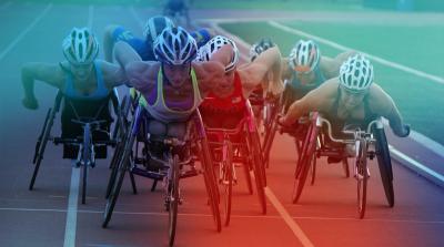 Image of 7 wheelchair track athletes racing
